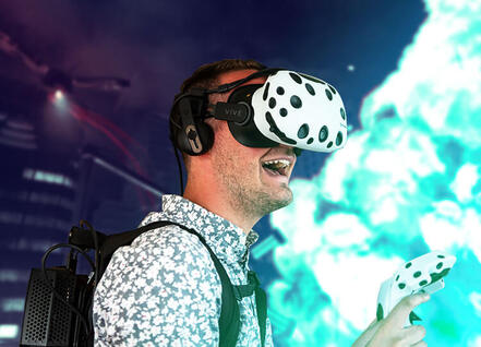 Player wearing vrCAVE Library products for Vive, Vive Pro, and Valve Index